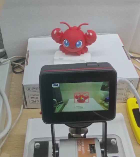 Figure 7: Red-object detection result, with detection box shown on the device screen. Source: this recording, cropped to show the physical device and target box on screen.